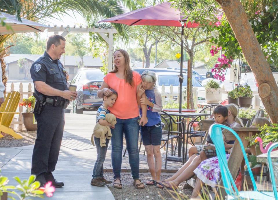 Chief Soelberg speaking with a mom at a community event