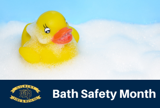 Rubber Duck in bathtub with the words Bath Safety Month