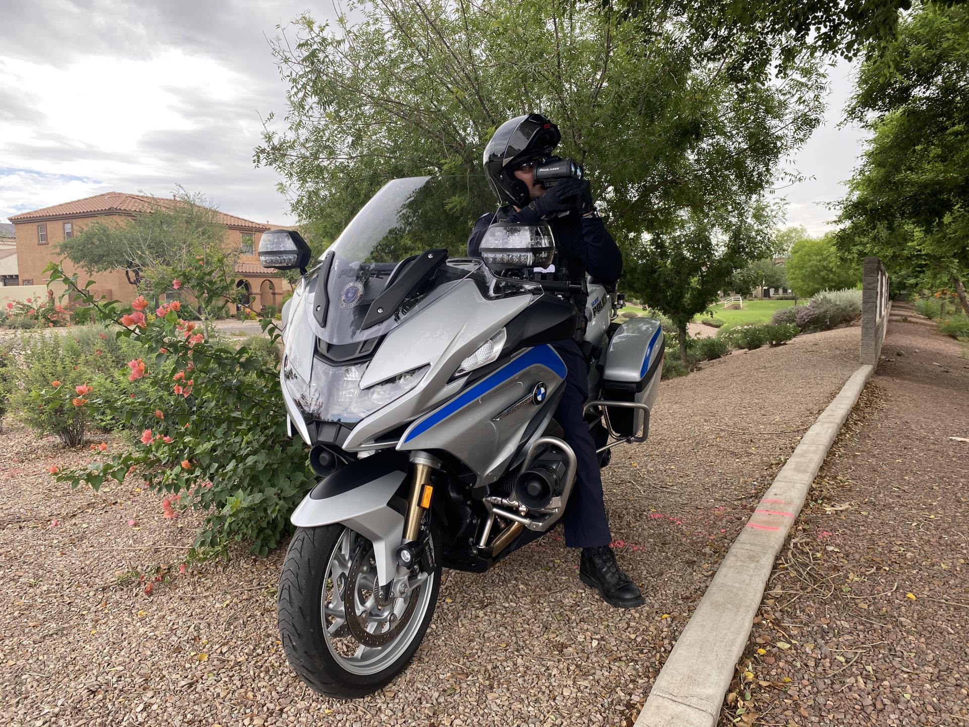 Photo of officer on silver motorcycle 