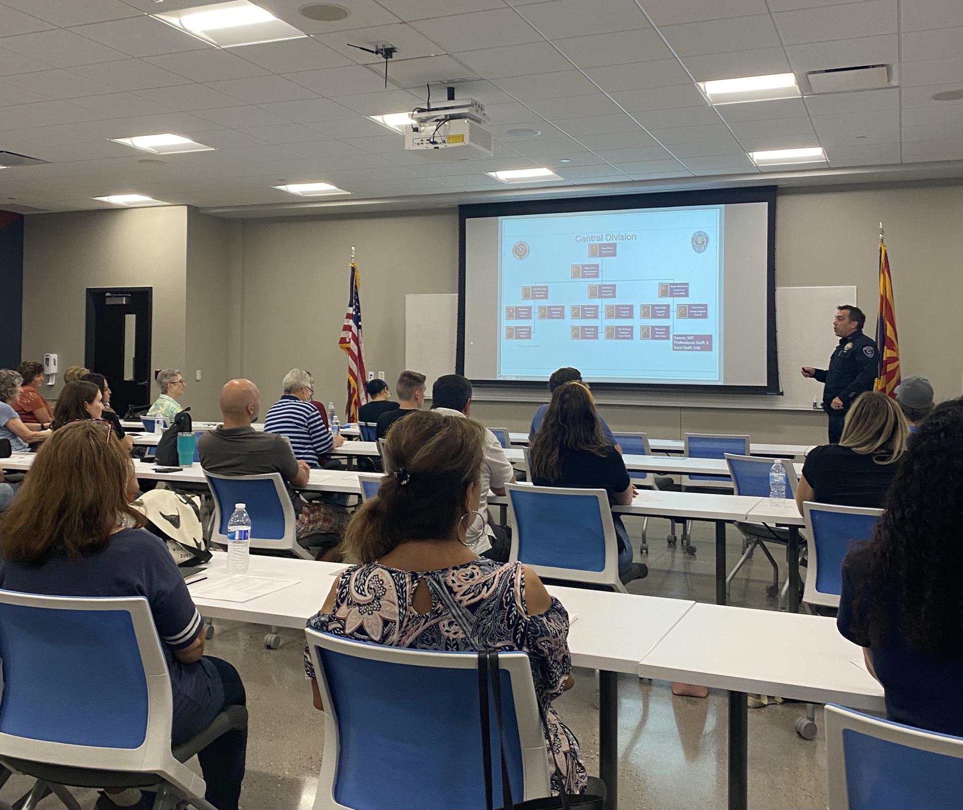 photo of people sitting at tables for citizens police academy