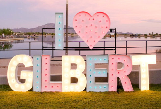 A neon sign at Gilbert Regional Park reads 'I love Gilbert.'