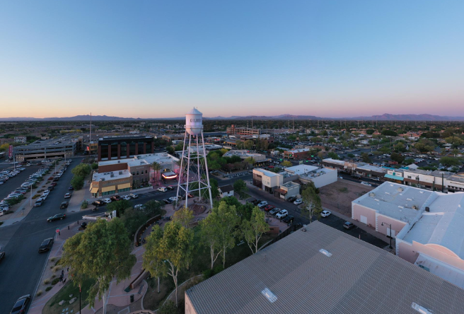 An aerial view of the Gilbert Water Tower Plaza at sunset.