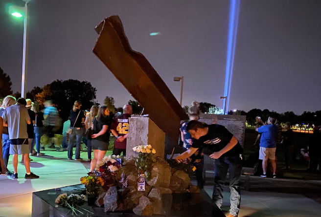 Gilbert 9/11 Memorial Beam in the foreground with the tribute in lights lit behind.