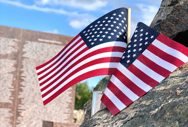 Two small American flags stick out from Gilbert's 9/11 Memorial - a steel beam that once held up the North Tower of the World Trade Center.