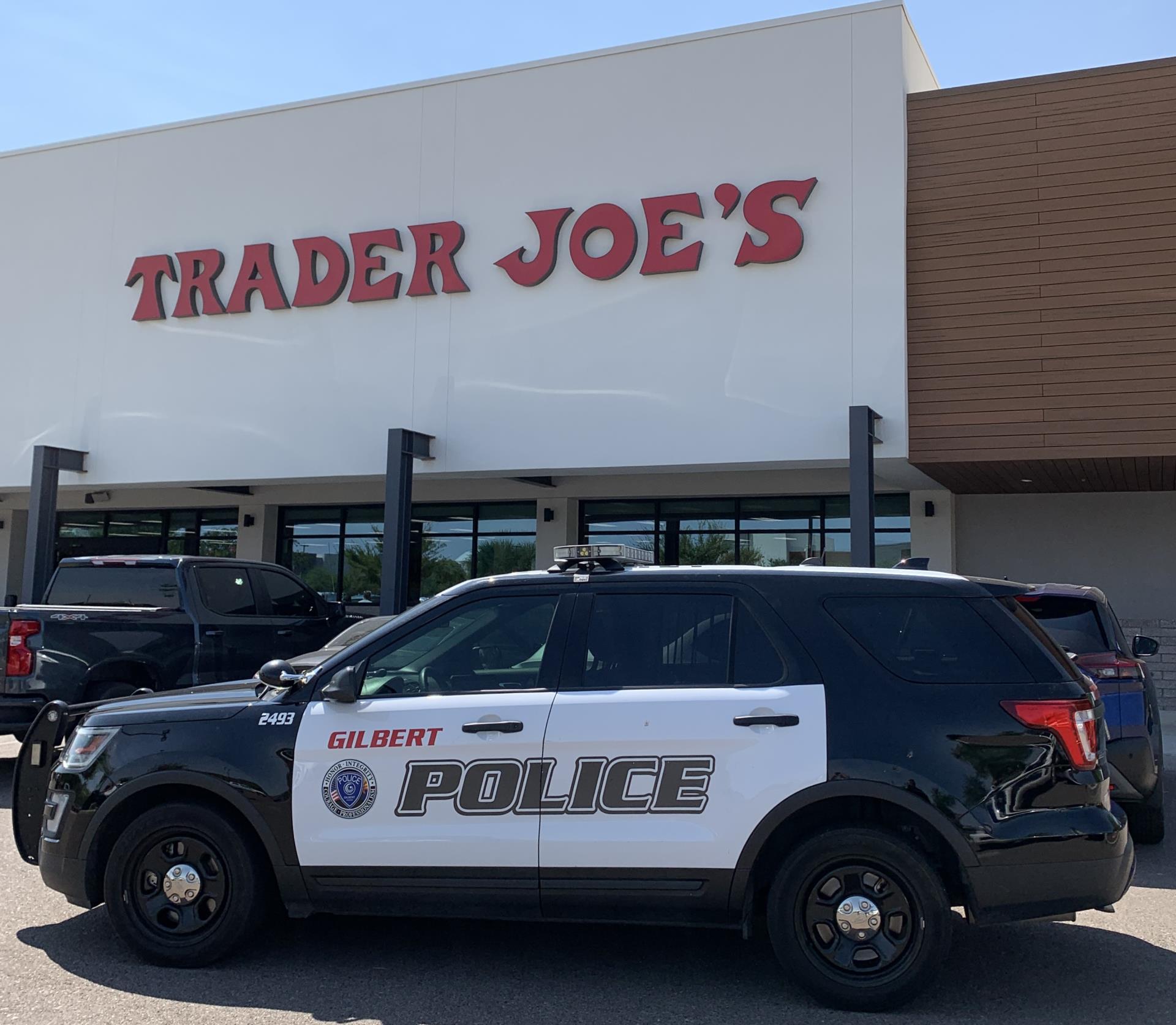 Photo of a Gilbert PD patrol car outside of Trader Joe's