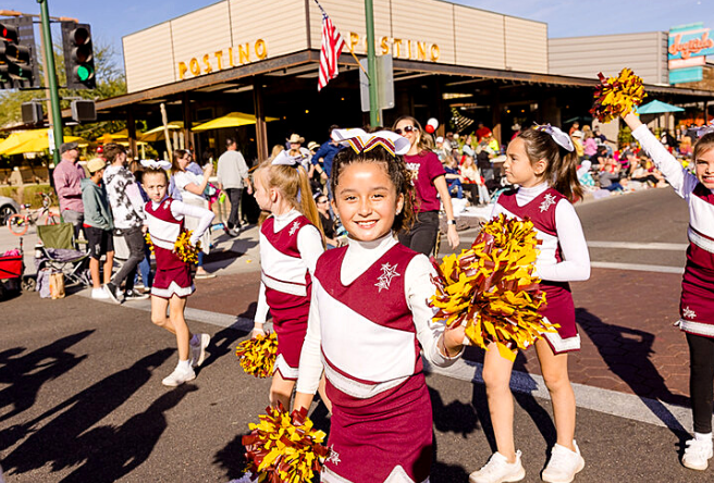 A young parade participant smiles for the camera during the 2021 Gilbert Days Parade.  