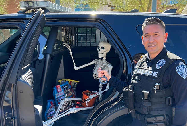 A Gilbert Police officer detains Mr. Bones, the candy thief, in the back of his patrol vehicle. No bones about it, this guy is bad news. 