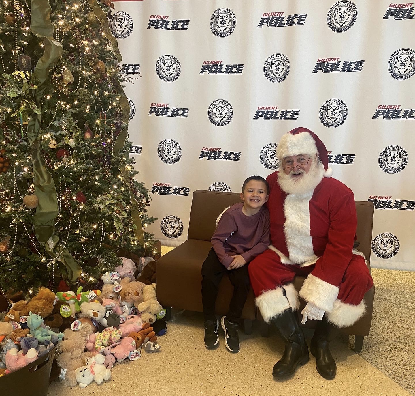 Photo of a boy sitting with Santa