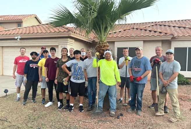 A group of volunteers pose for a photo.