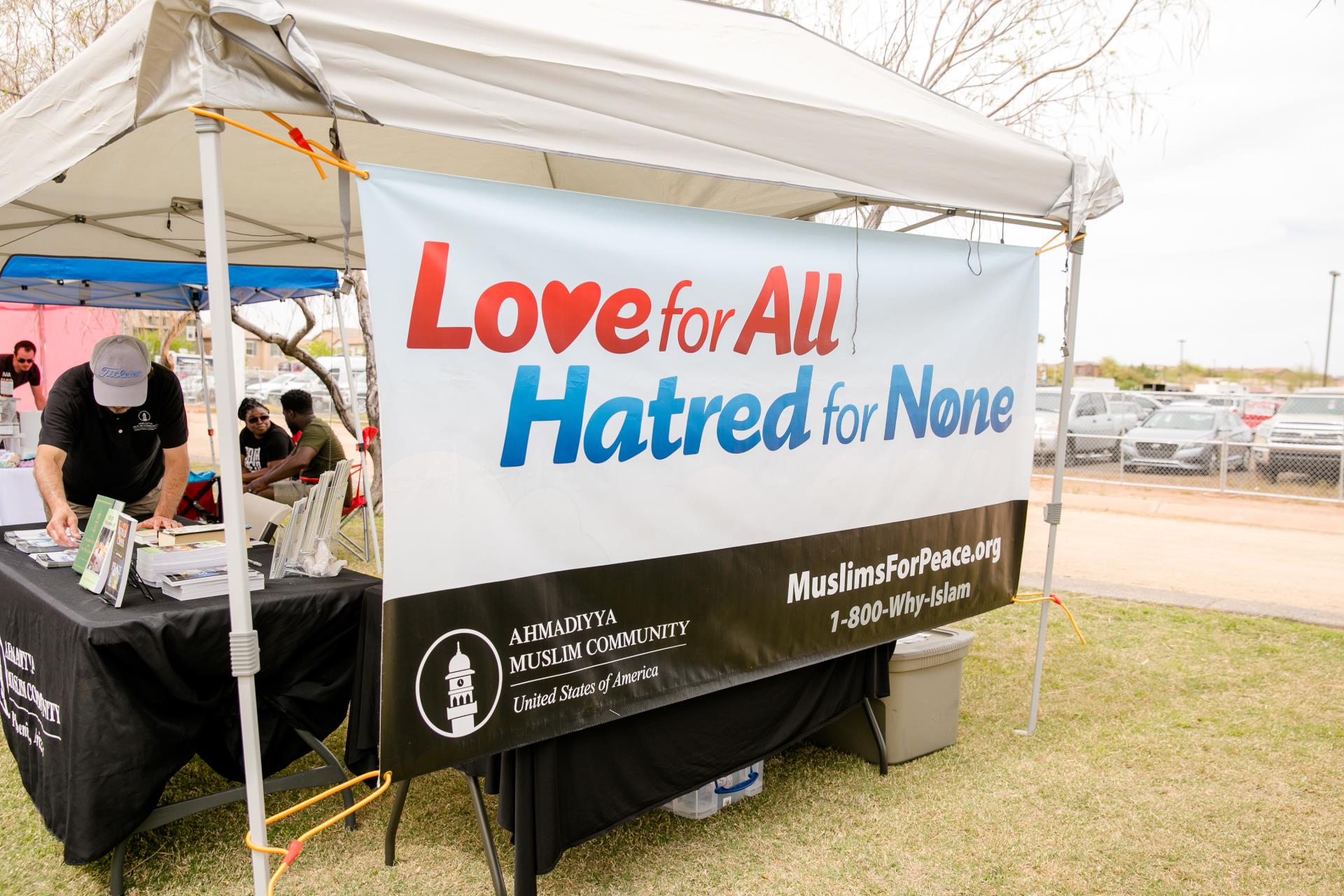 This is a photo of the Ahmadiyya Muslim Community booth where patrons can learn more about the religion. 