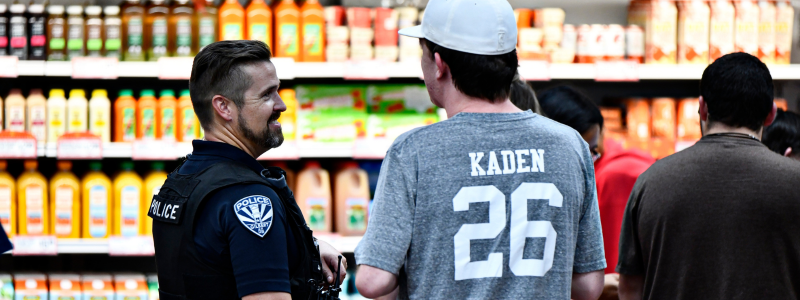 officer smiles at a student