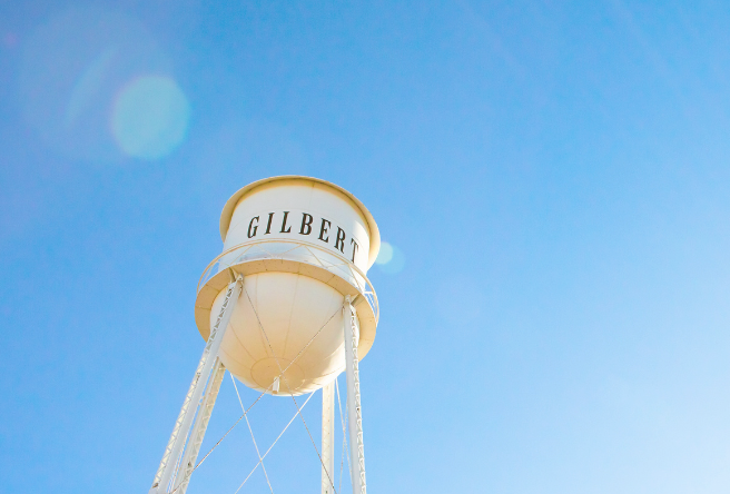 A photo of the Gilbert Water Tower against a blue sky.