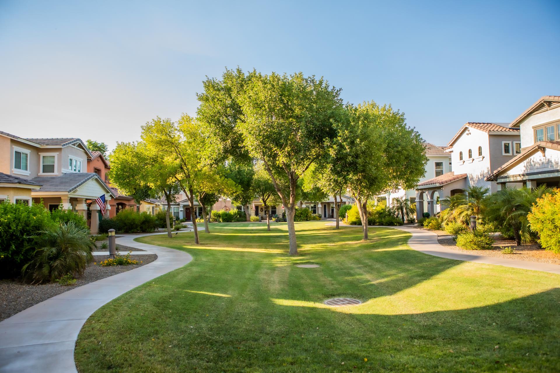 Neighborhood photo with houses and greenbelt down the middle