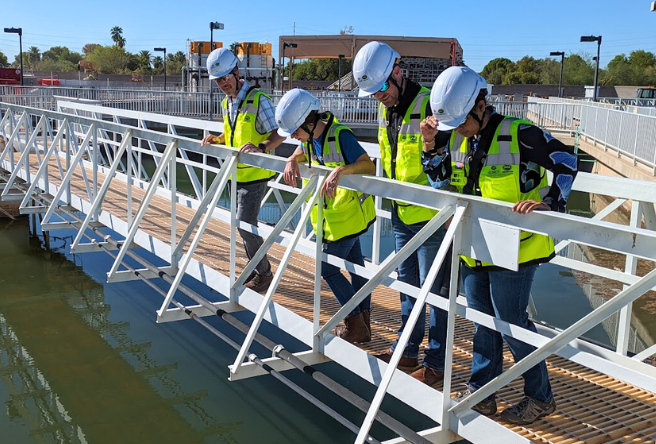 Members of the Public Works Advisory Board tour a town water facility. 