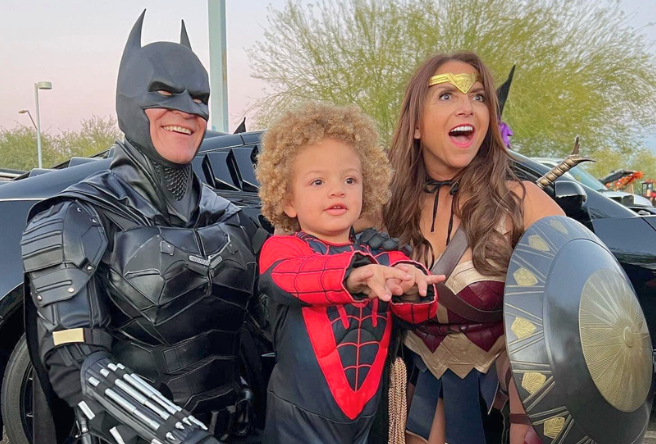 A group of superheroes pose during a trunk-or-treat event in Gilbert, Arizona.