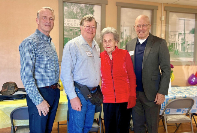 June Morrison poses for a group photo with her three sons inside the Neely Community Room at HD SOUTH.