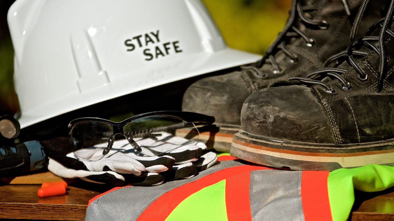 Hard hat, steel toed shoes, and vest