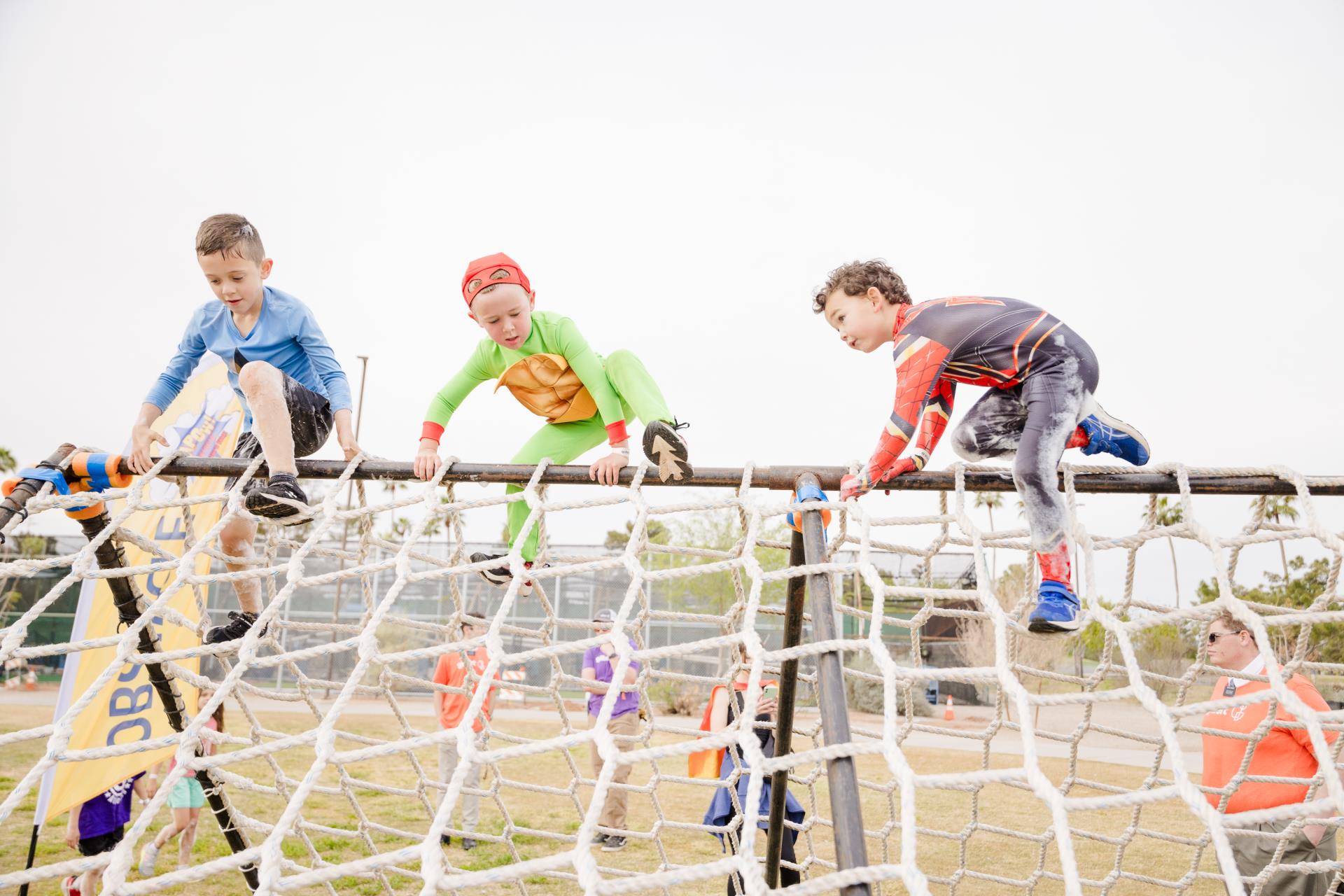 This is a photo of three participants on the KAPOW course. 