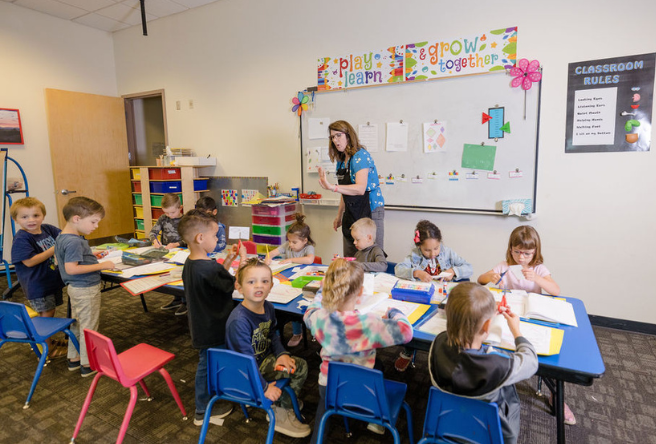 Children working on school work in a classroom at the Southeast Regional Library