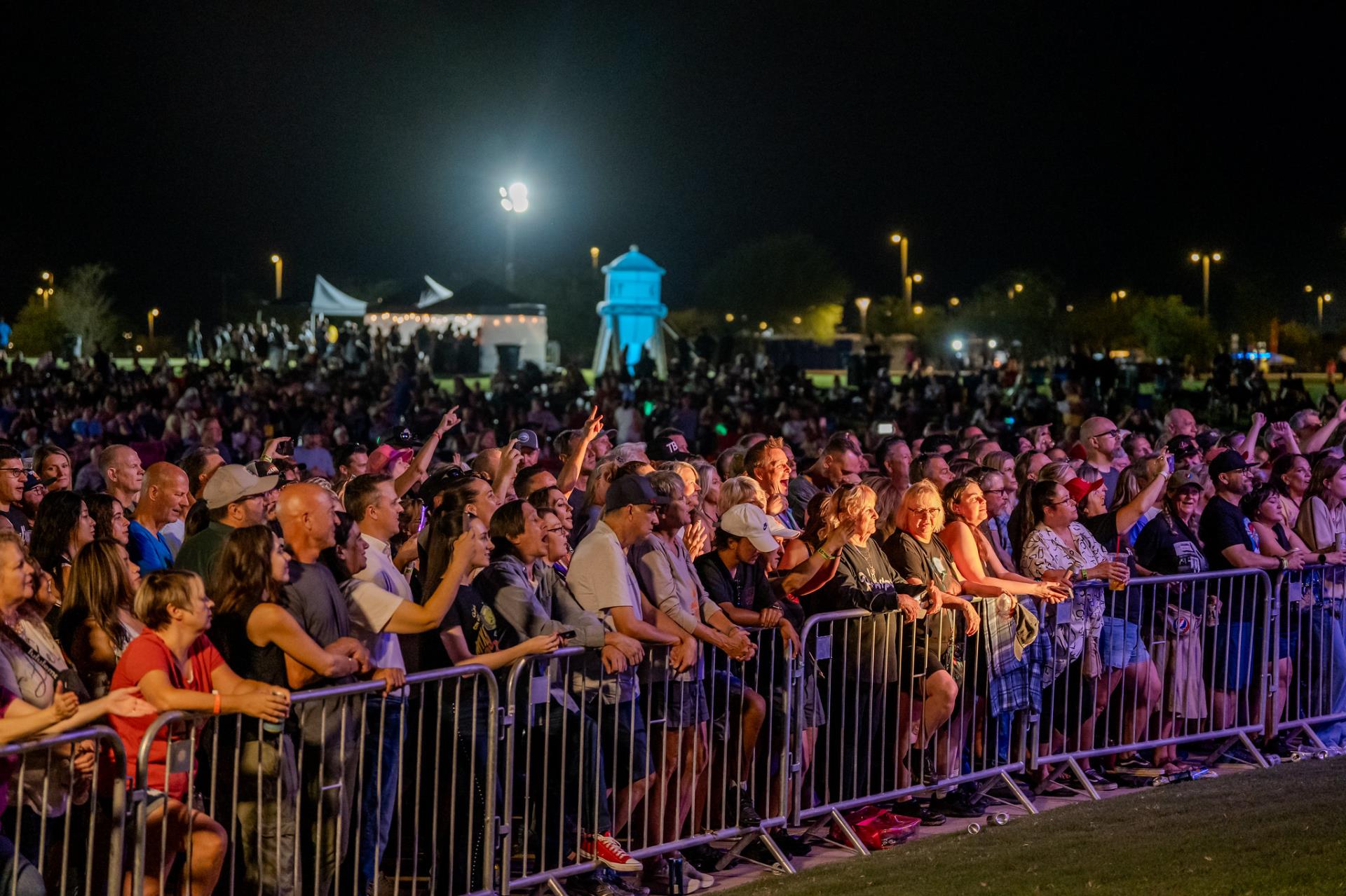 Crowd enjoying a concert at Gilbert regional Park